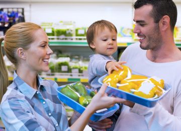 Young beautiful couple have buying vegetable at supermarket