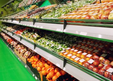 Shelves with fruits in food supermarket shrinkwrapped